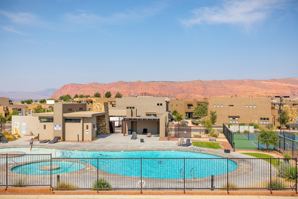 Our home is located across the street from the pool.