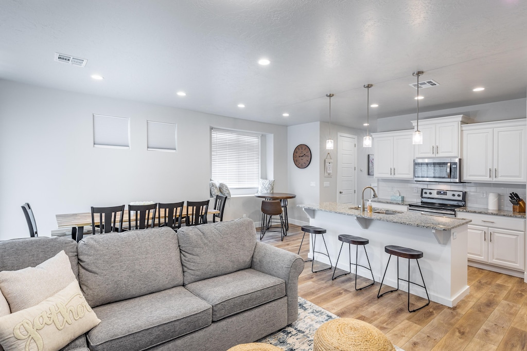 The Living Room is conveniently located adjacent to the Kitchen and Dining Table and is a great place for entertaining guests during downtime.