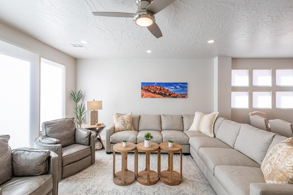 The living room is designed as an open floor plan and is a great gathering place for meals, games, or watching TV during your stay.