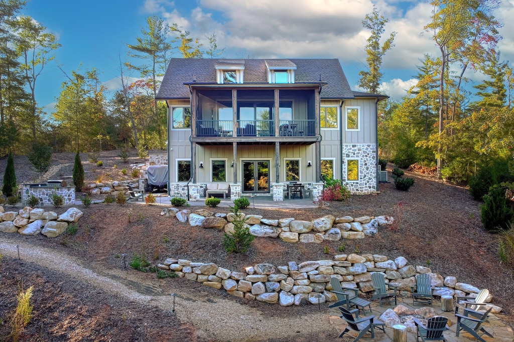 A stunning exterior shot showcasing the lodge's modern architecture, nestled atop a hill with panoramic views of Lake James.