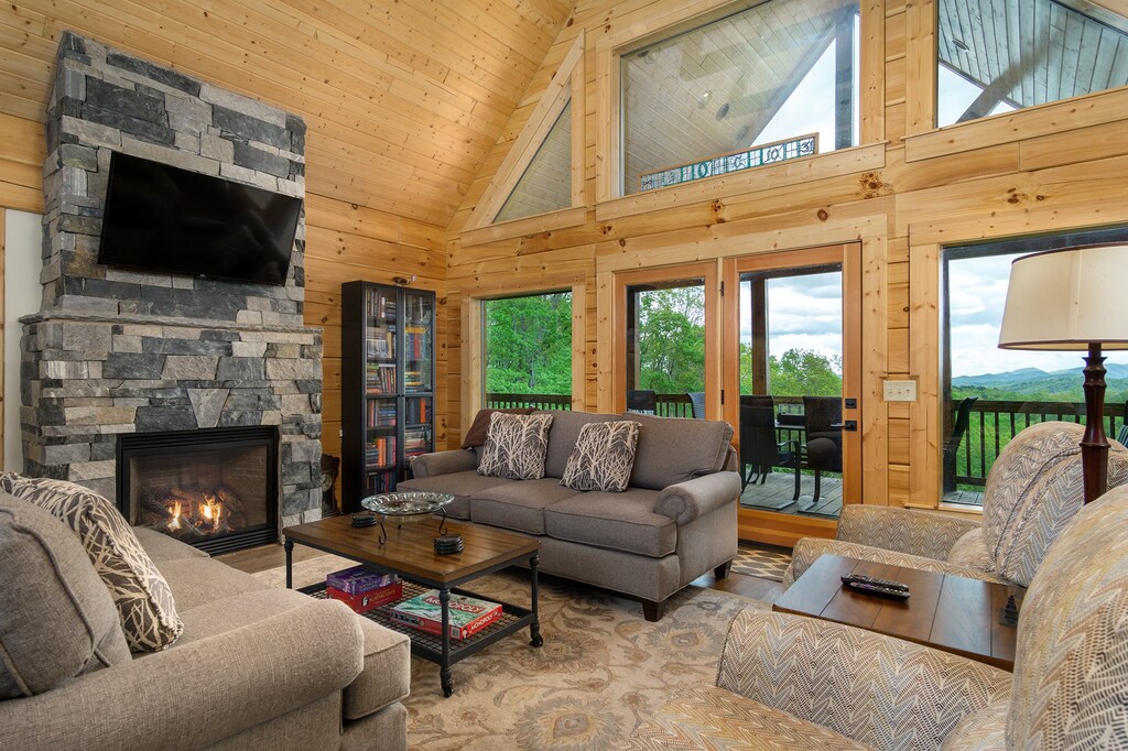 Living room with 55" smart TV (satellite & streaming available) & gas logs fireplace.