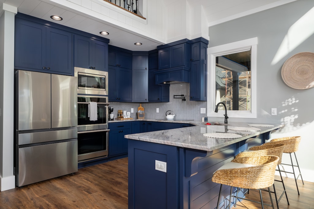 Modern fully- stocked kitchen features stainless steel appliances and both k-cup & drip coffee options. 