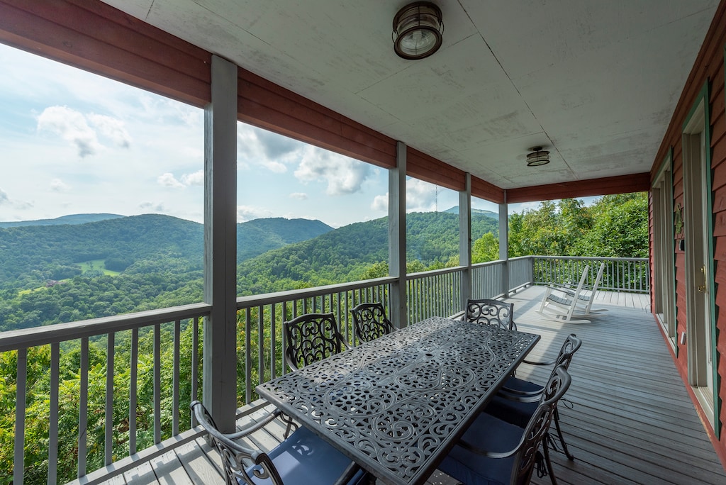 Outdoor dining area with stunning mountain views & seating for 6.