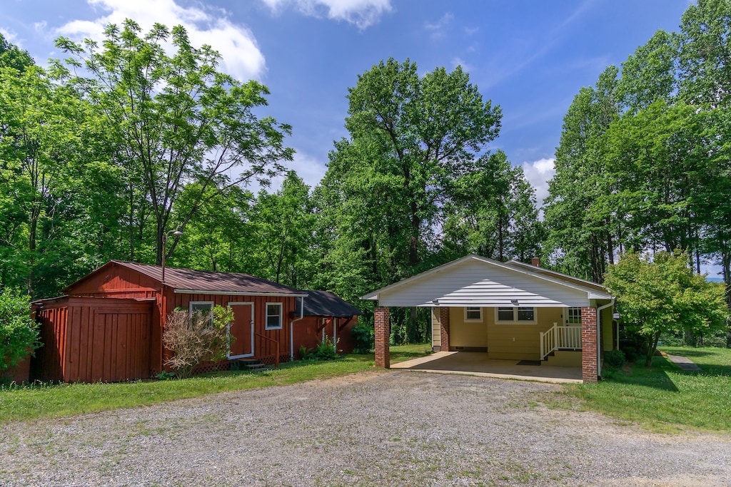 Parking area alongside the house.