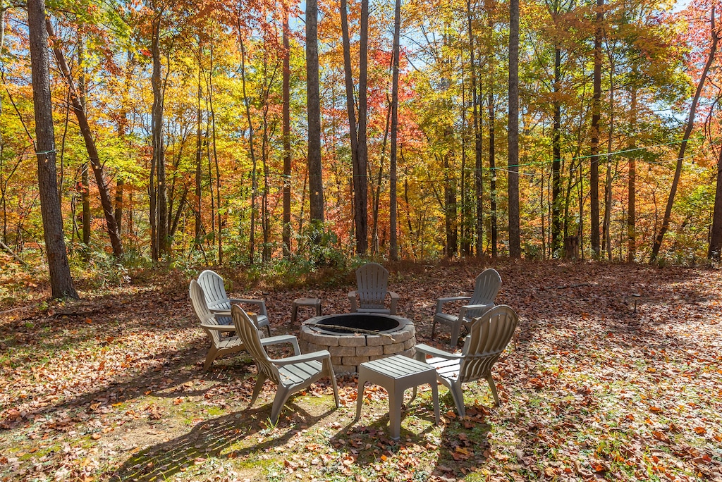 Wood-burning fire pit with string lights and seating for 6.
