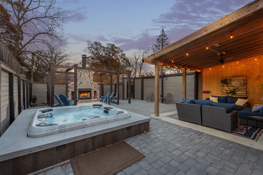You'll love the fully enclosed courtyard with hot tub, covered lounge area, outdoor dining for 6, and custom stone fireplace with pergola and Adirondack seating at Stone Court!