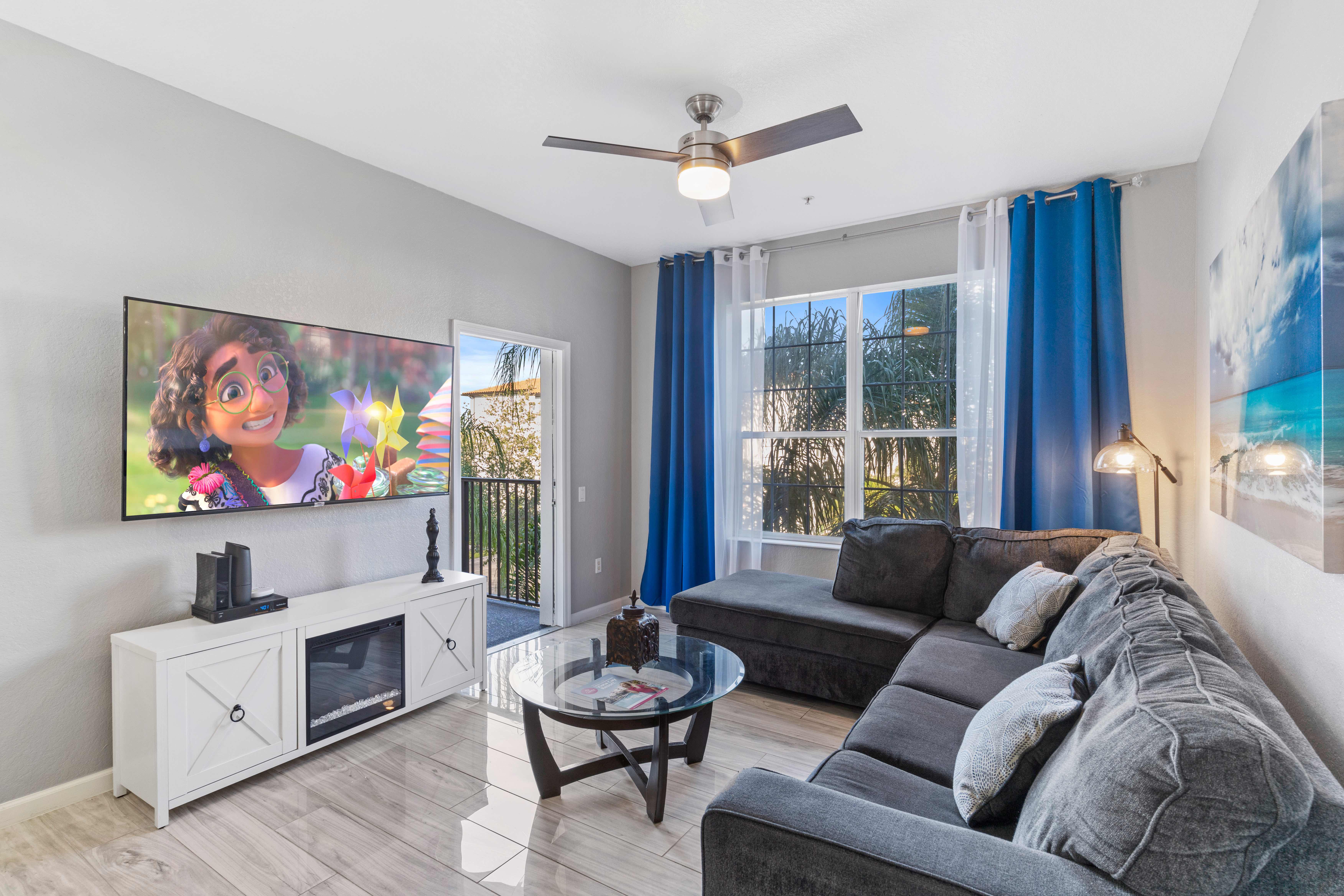 The living room at Vista Cay Resort is a welcoming retreat where guests can unwind and socialize, blending modern comfort with elegant design to create a cozy and inviting atmosphere within Orlando's vibrant ambiance.