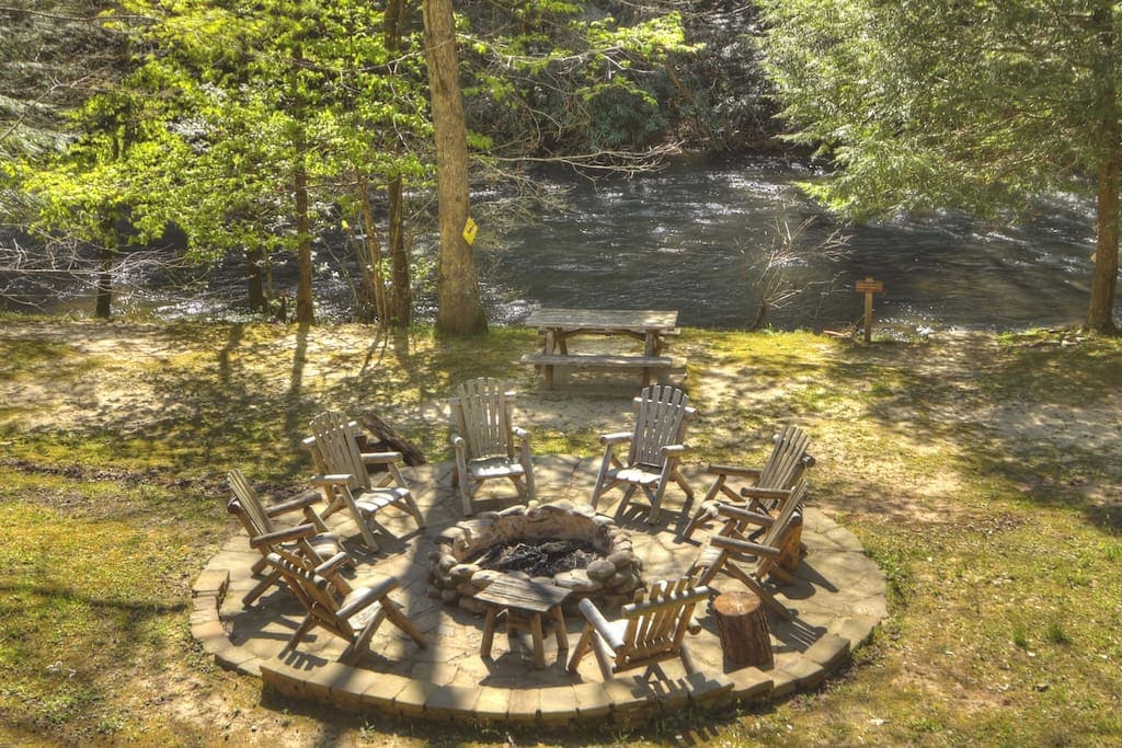 Enjoy the fire pit, large yard, and picnic table by the creek 