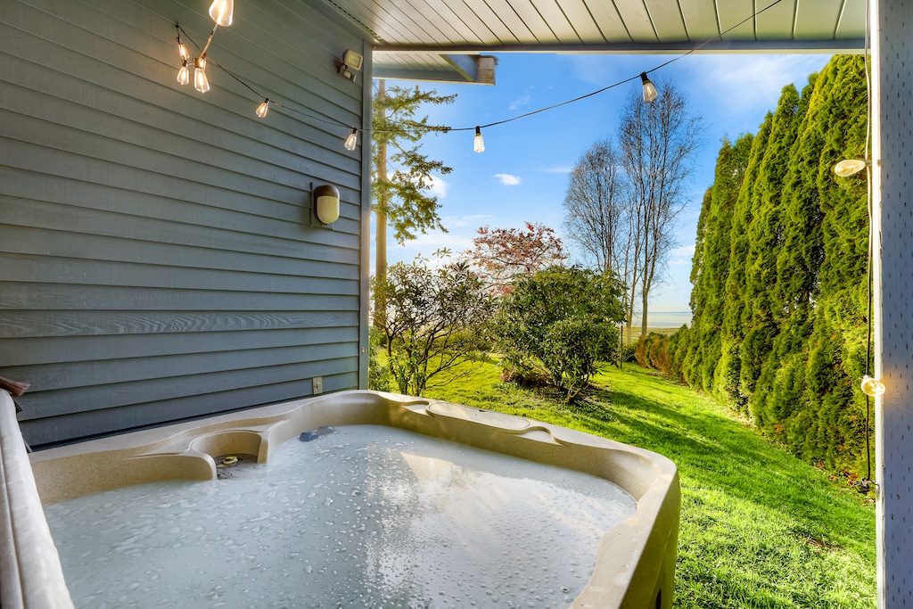 Private outdoor hot tub ready to provide a luxurious soak, nestled in a secluded space for ultimate relaxation and rejuvenation.