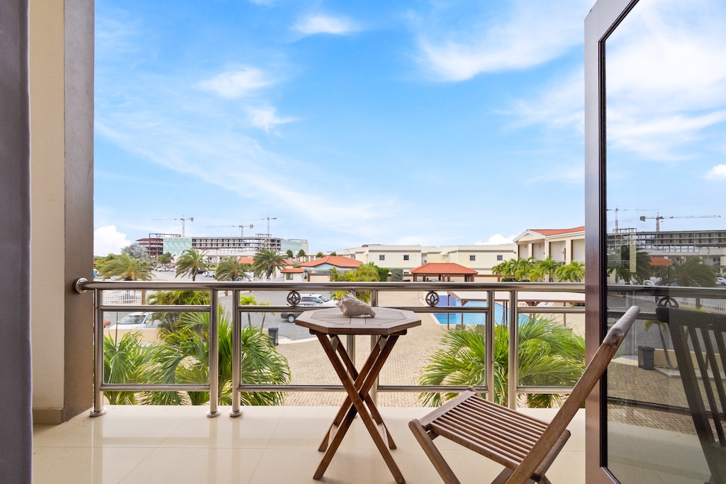 Private Balcony of the 2BR Condo in Noord Aruba - With view of the pool - Refreshing Atmosphere - Mesmerizing views