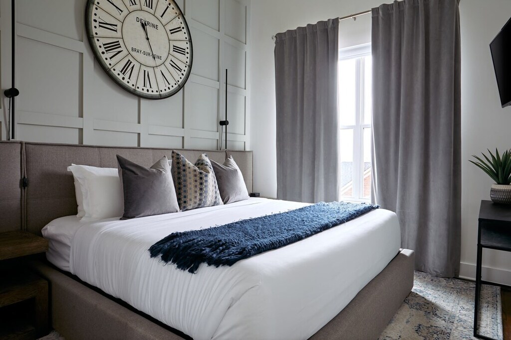 Relax in this cozy queen bed after a long day exploring Music City!