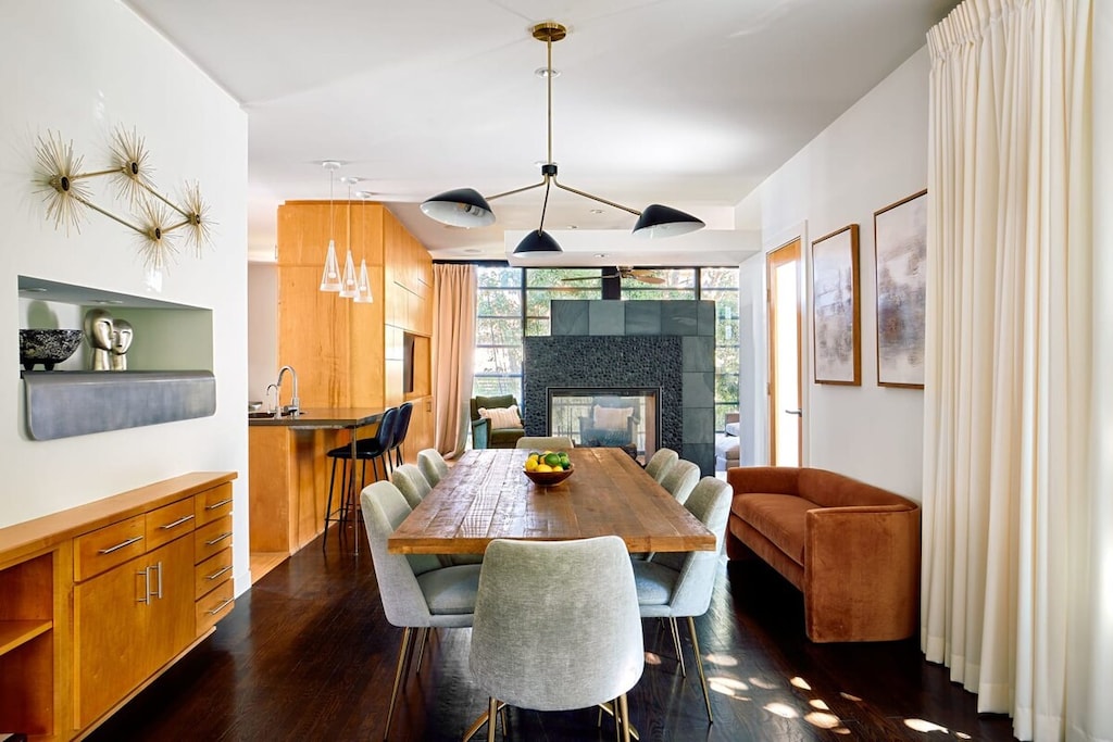 Move effortlessly from meal prep to mingling in this thoughtfully designed space, where the kitchen, dining, and living areas flow together beautifully.