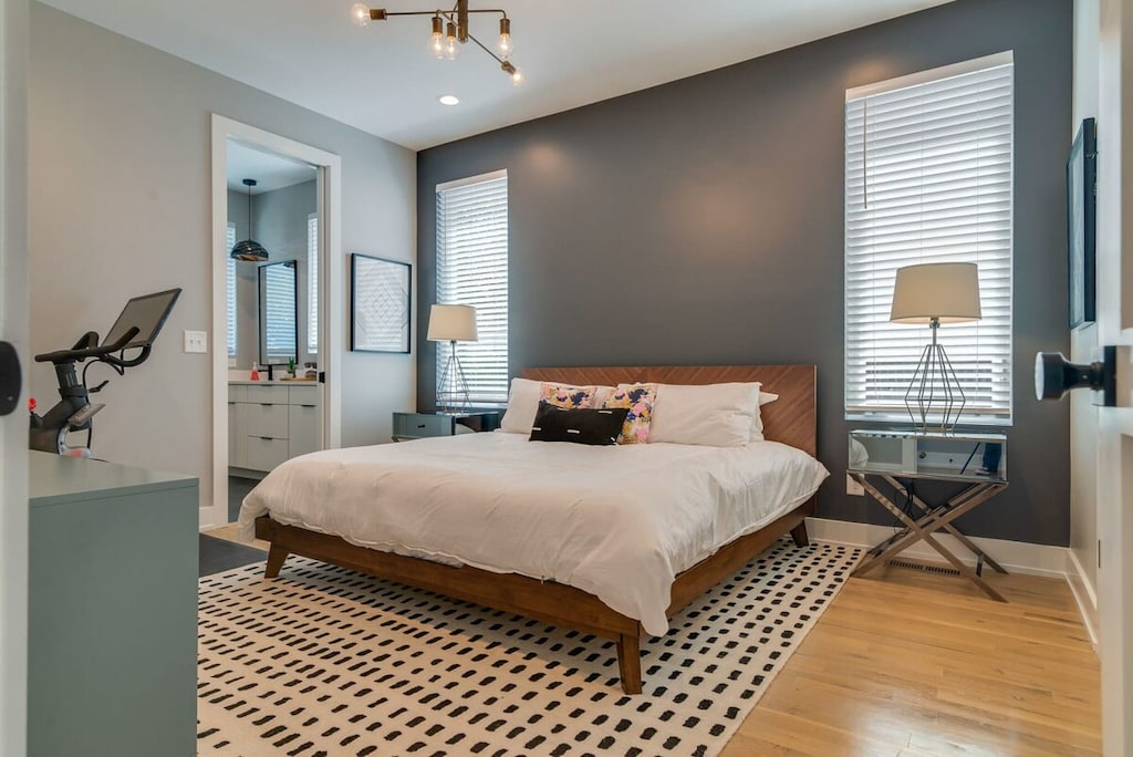 Comfort and fitness right at your fingertips in the primary bedroom with a private ensuite and a Peloton.