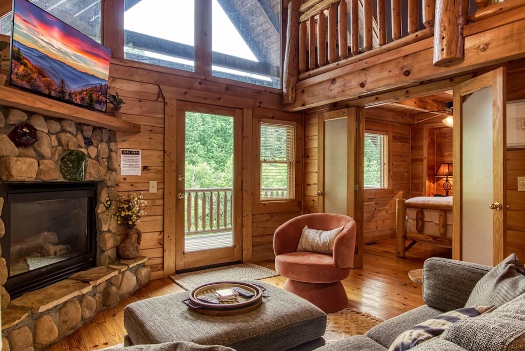 Cozy up in the living room with plush seating, your favorite shows on the Smart TV, and serene nature views. Indoor fireplace operational during colder months.