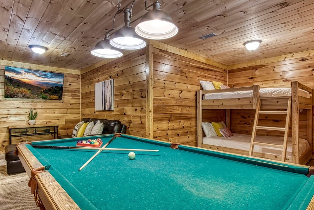 Gather your crew for a game of pool in this spacious first-floor den. With a second living area designed for fun and relaxation.