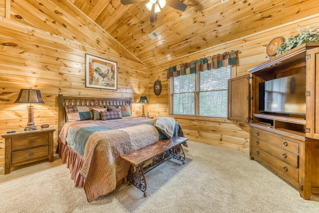A beautiful upstairs bedroom retreat with rustic decor and comfortable bedding, plus an en suite bath!
