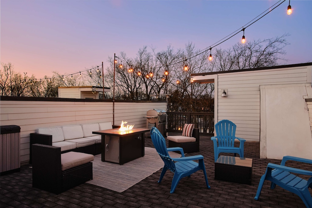 Gather at The Johnny, your artsy rooftop retreat with skyline views, a grill, and fire pit made for laid-back nights and good company.