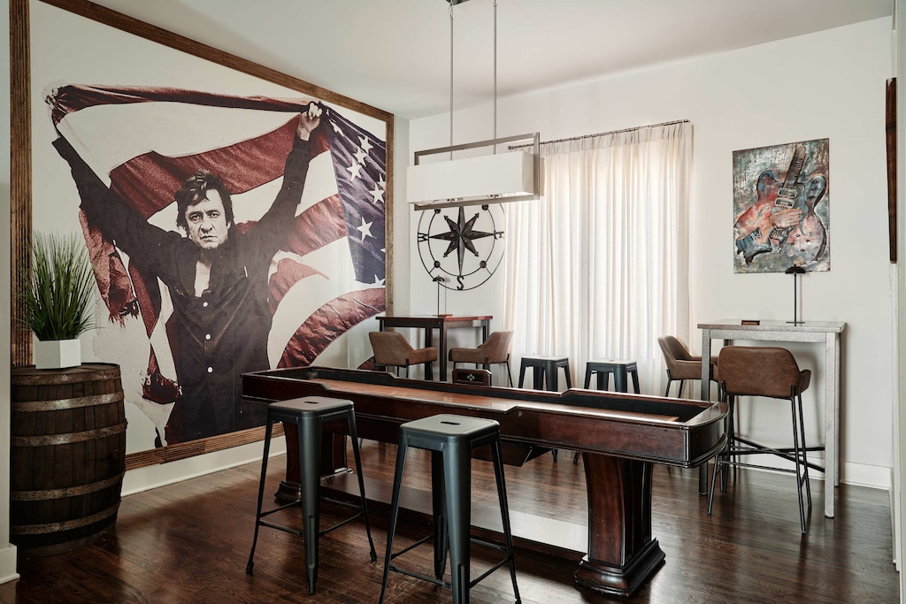 Strike a pose with Johnny and challenge your crew to a game. This bold, Instagram-ready space brings the fun with a full shuffleboard setup.