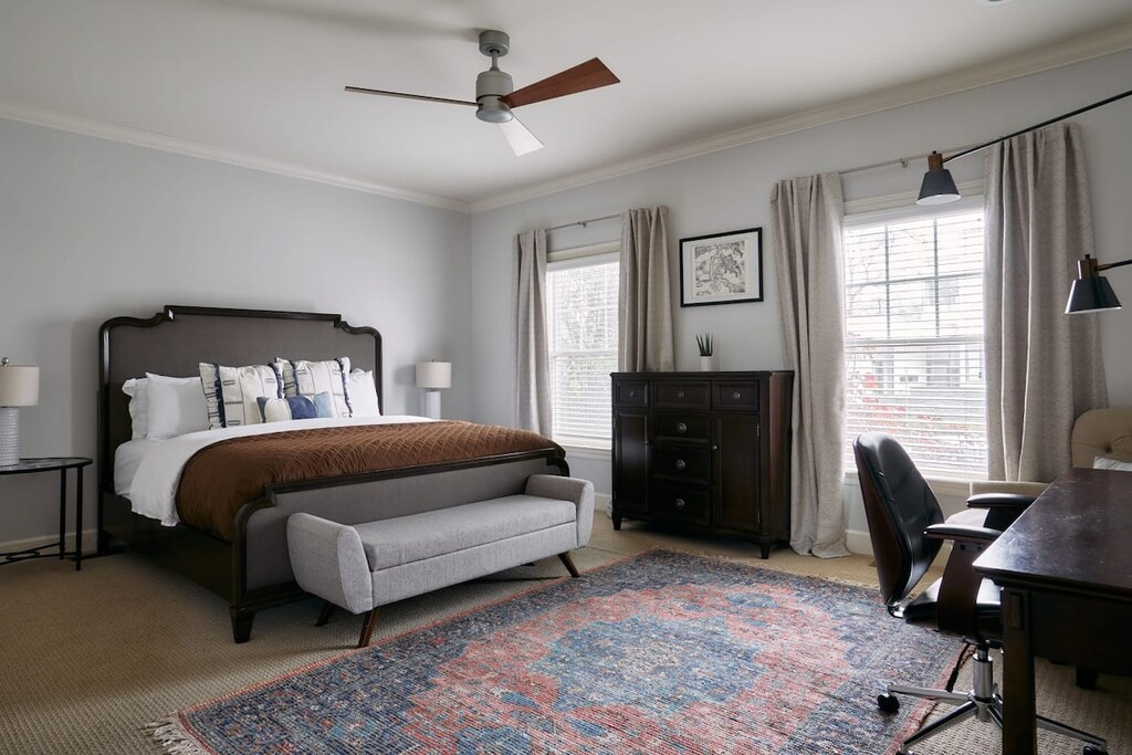 Convenience awaits at the main-floor primary bedroom, complete with a cozy workspace and a full bathroom.