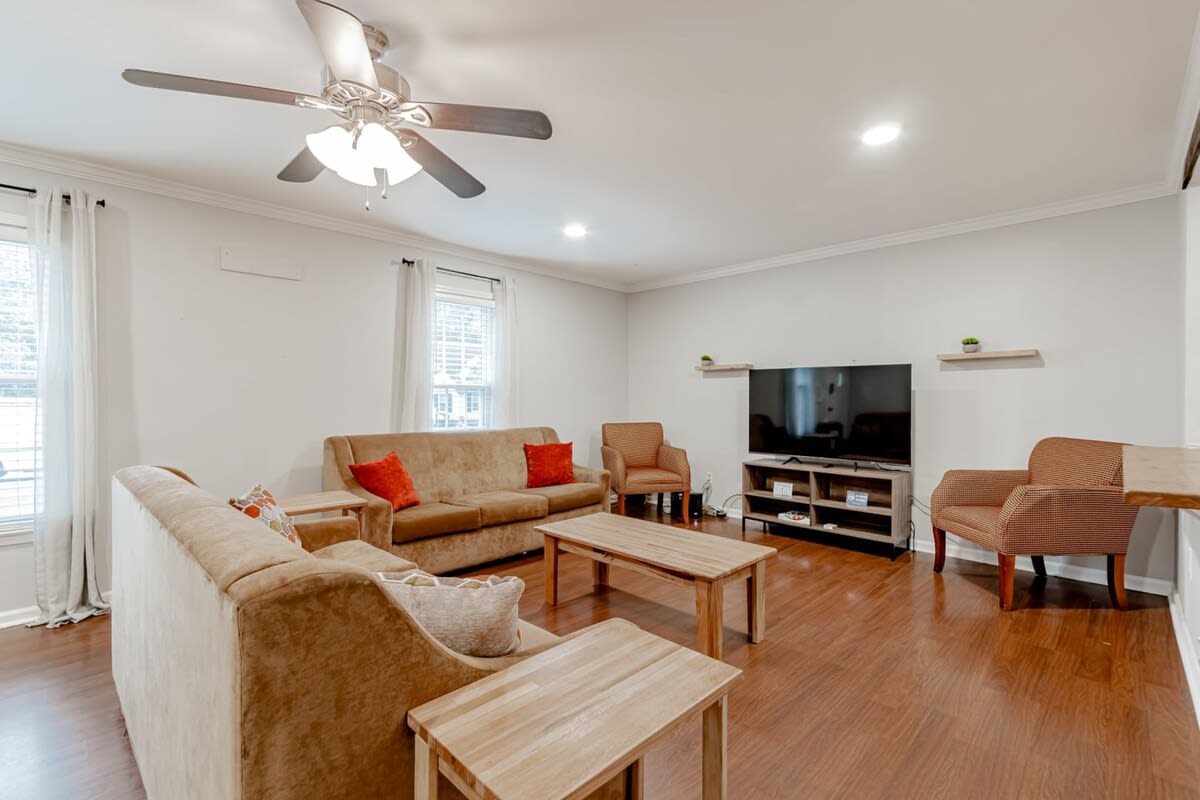 Open family room with flat screen TV complete with Roku.