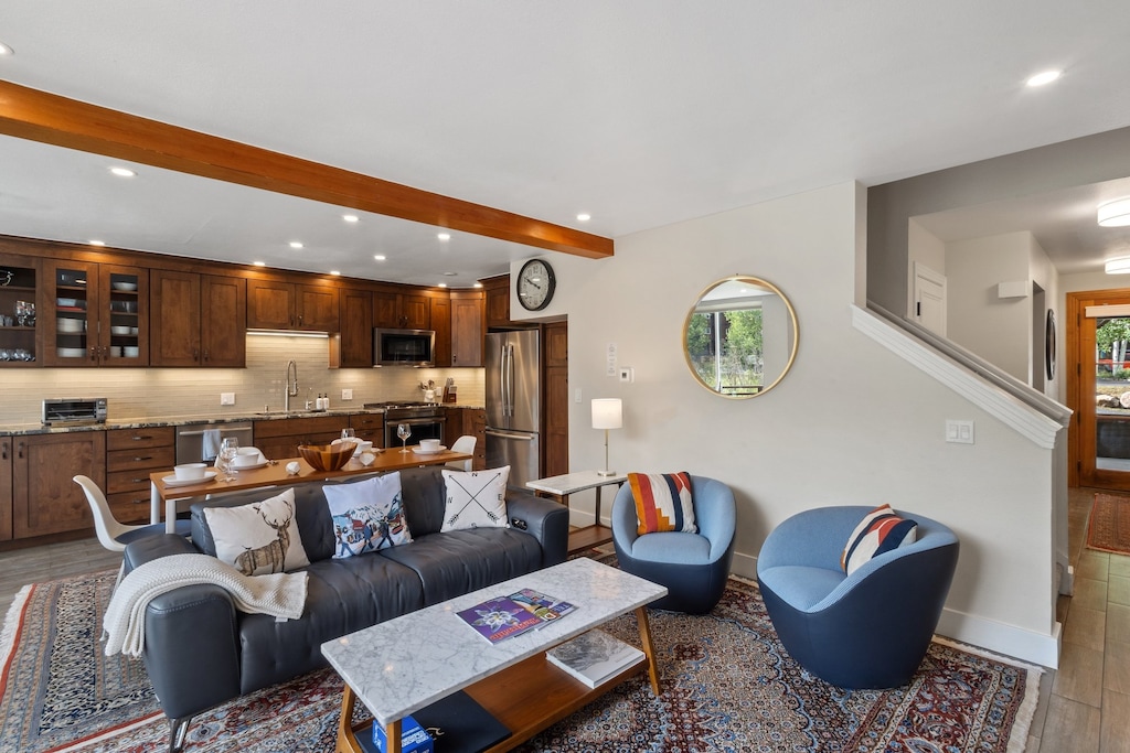 The first level opens up to a large living room, kitchen and spacious deck with plenty of natural light and a gas fireplace.