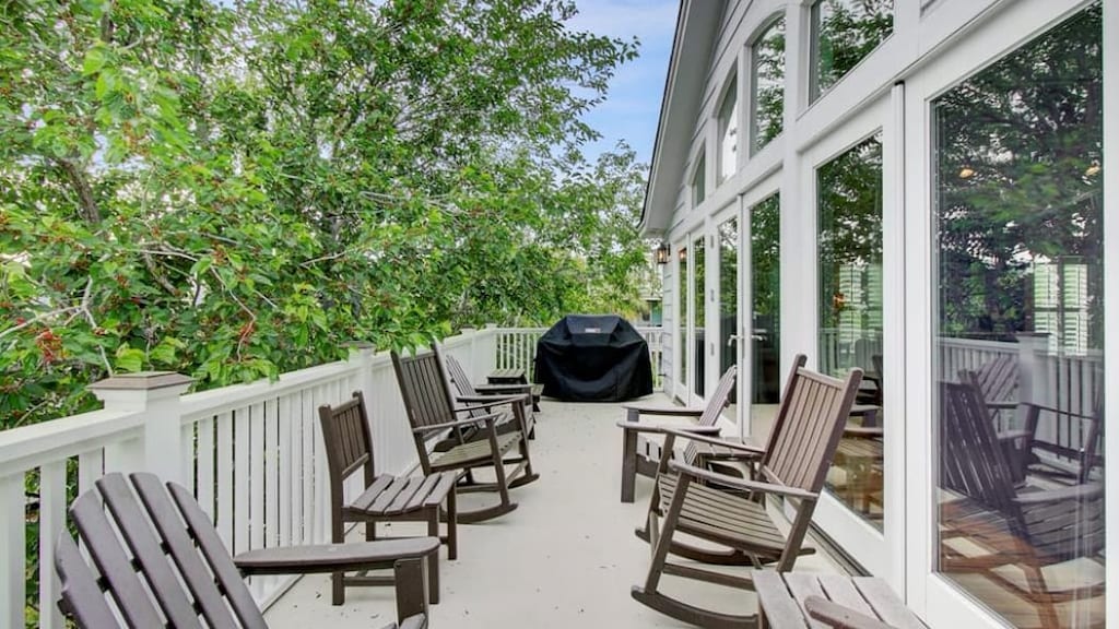Back porch with rockers & propane grill.
