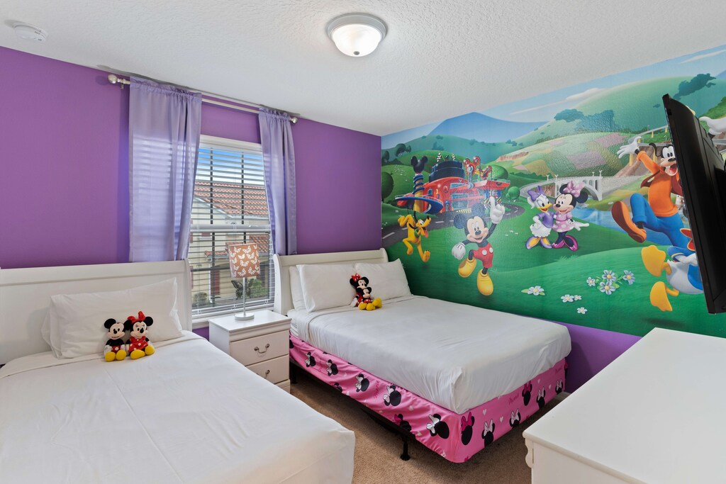 A playful bedroom for two, comfortable beds perfect for kids you will bring