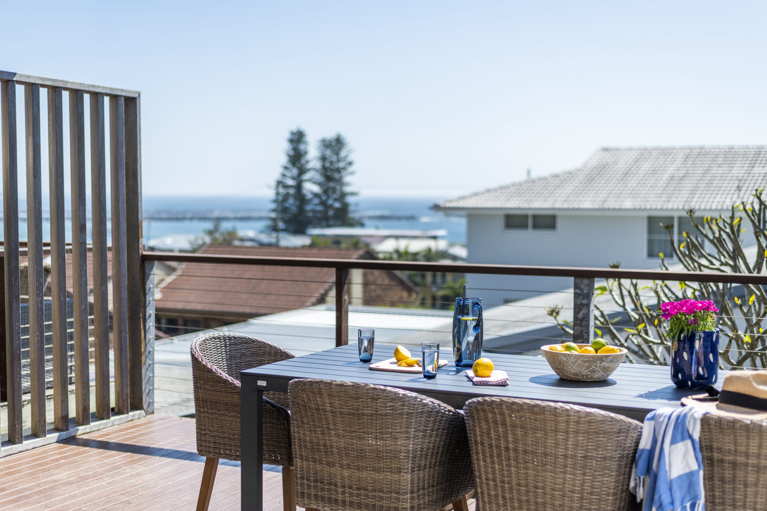 Bimbajong Pines - Coast accommodation in Yamba town with Ocean views - Upstairs balcony with ocean views, barbeque & 8 seater dining set