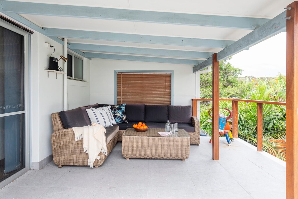 Captain's Haven - Yamba pet-friendly accommodation - Rear balcony with bbq, overlooking rear garden and hot tub