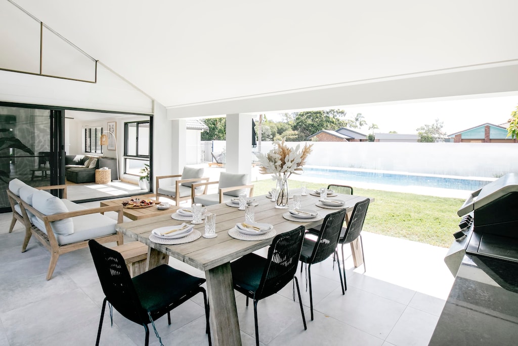 Alfresco living overlooking the pool and canal