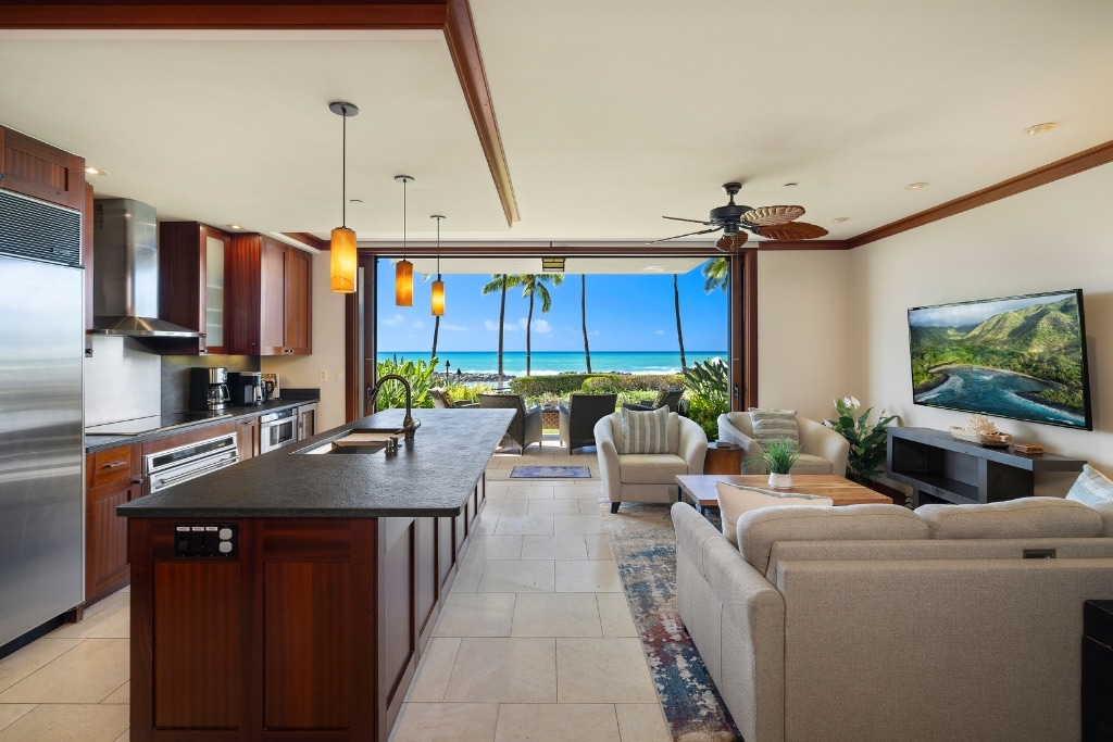 Tall ceilings and open concept design blends living, dining and kitchen areas of Ko Olina Beach Villas B109.