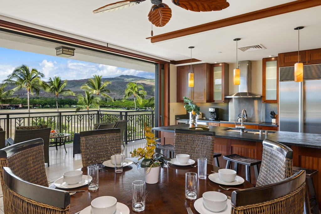Open an inviting indoor-outdoor living space with ocean and mountain views