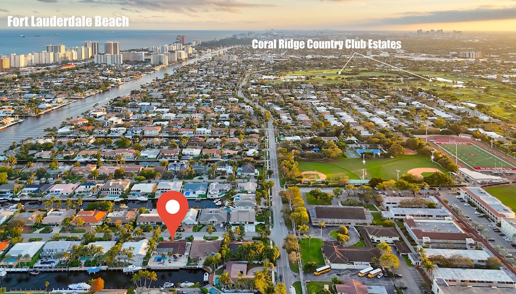 Beautiful Waterfront Home with no fixed bridges. 5 minutes from the beach and walk to prestigious Coral Ridge Country Club Estates