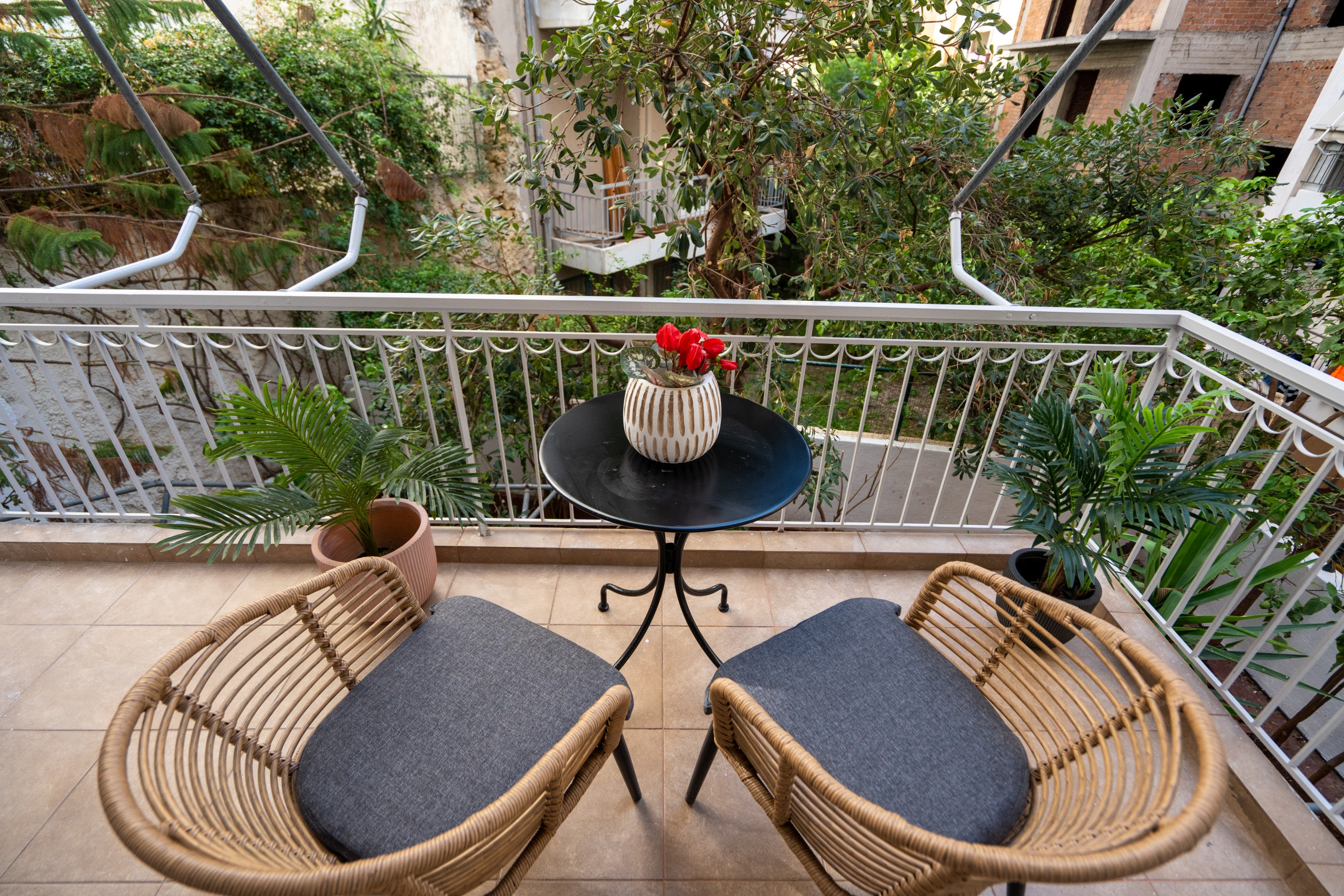 Your spacious furnished balcony is the perfect spot for enjoying a coffee or drink with verdant views. 