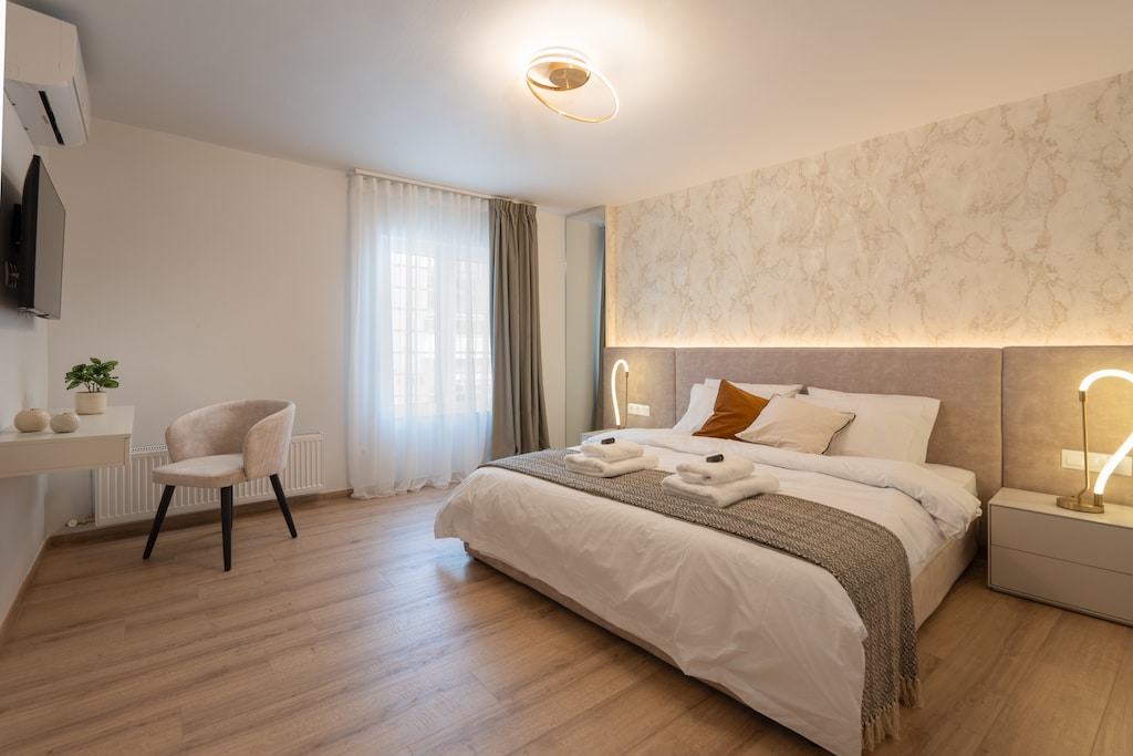 Each bedroom is individually styled in calming white and earthy tones.