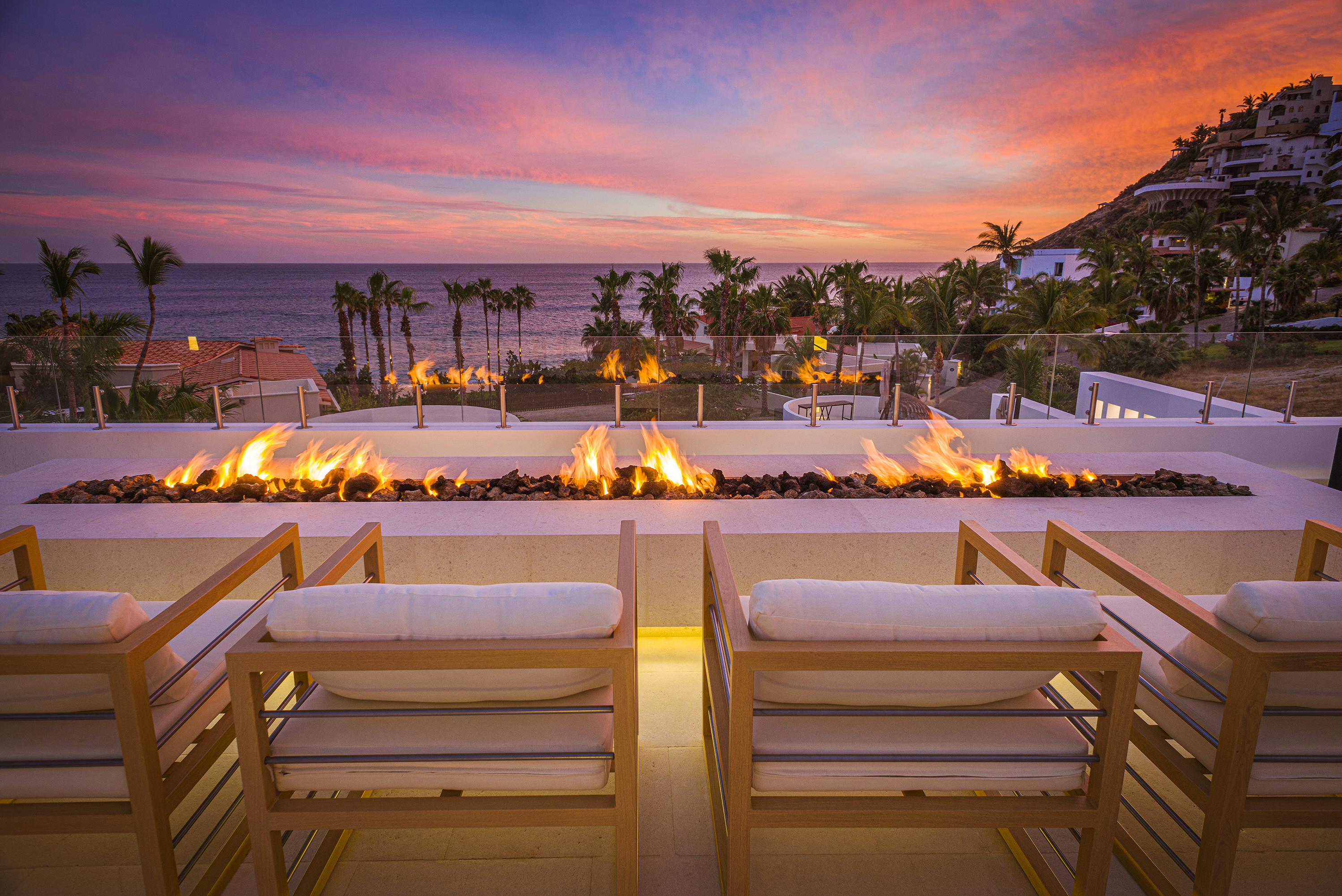 Firepit seating with ocean view during sunset