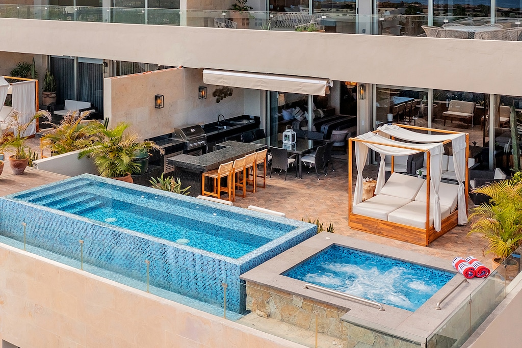 Sunny patio with pool, jacuzzi and lounge