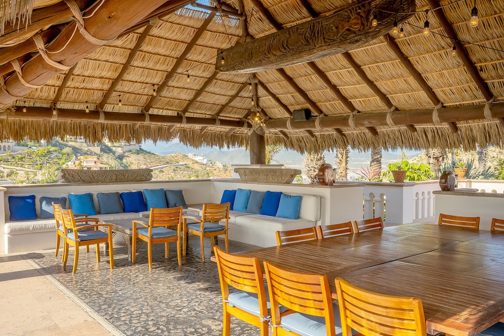 Outdoor seating and dining under the palapa