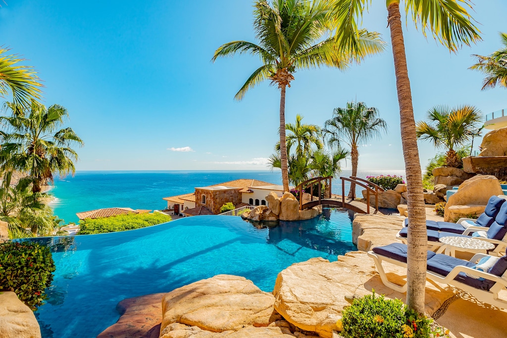 Patio with infinity edge pool and ocean view