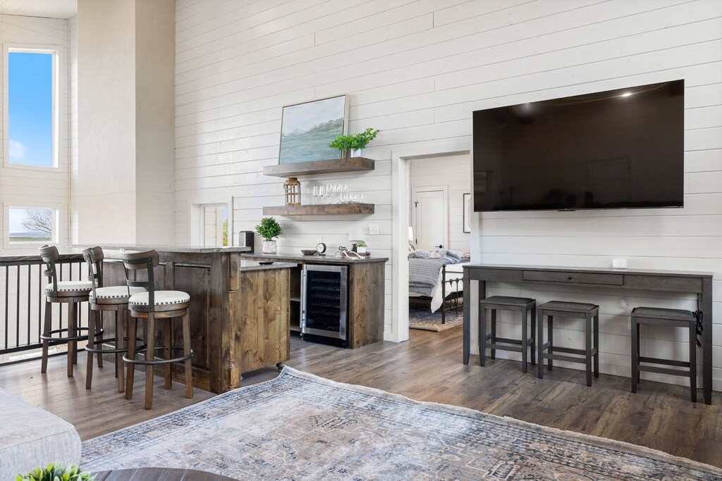 Separate bar area upstairs in game room with island seating
