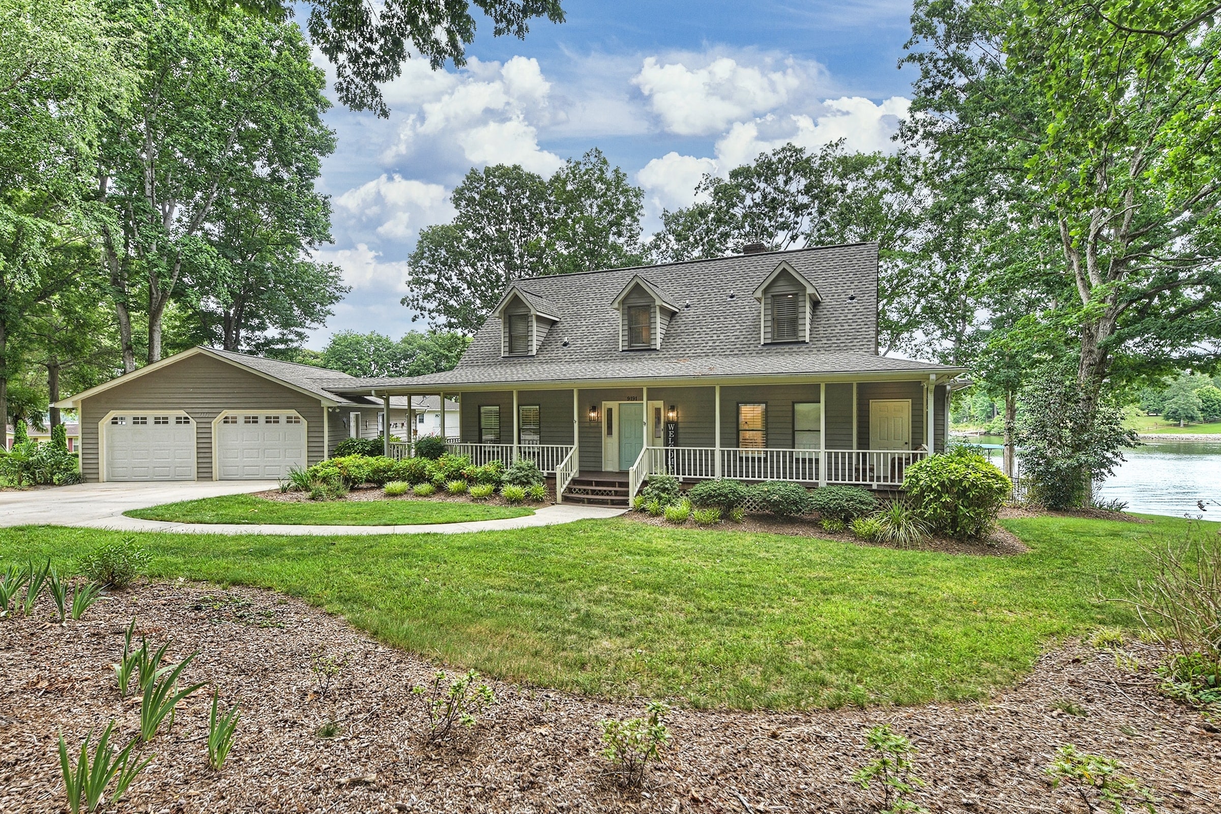 A Frame Of Mind boasts a wrap-around porch, an oversized two-car garage with a game room.