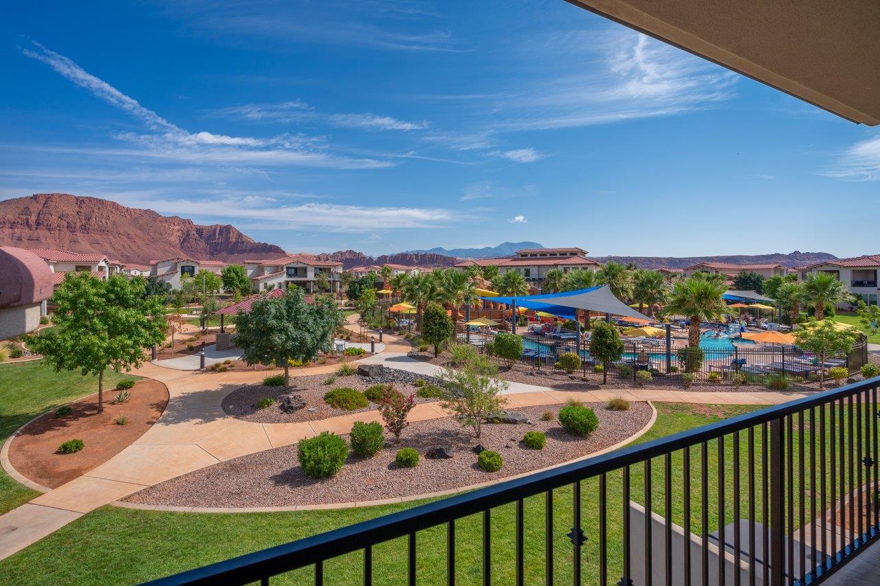 Great poolside and red mountain views from the balcony of this home