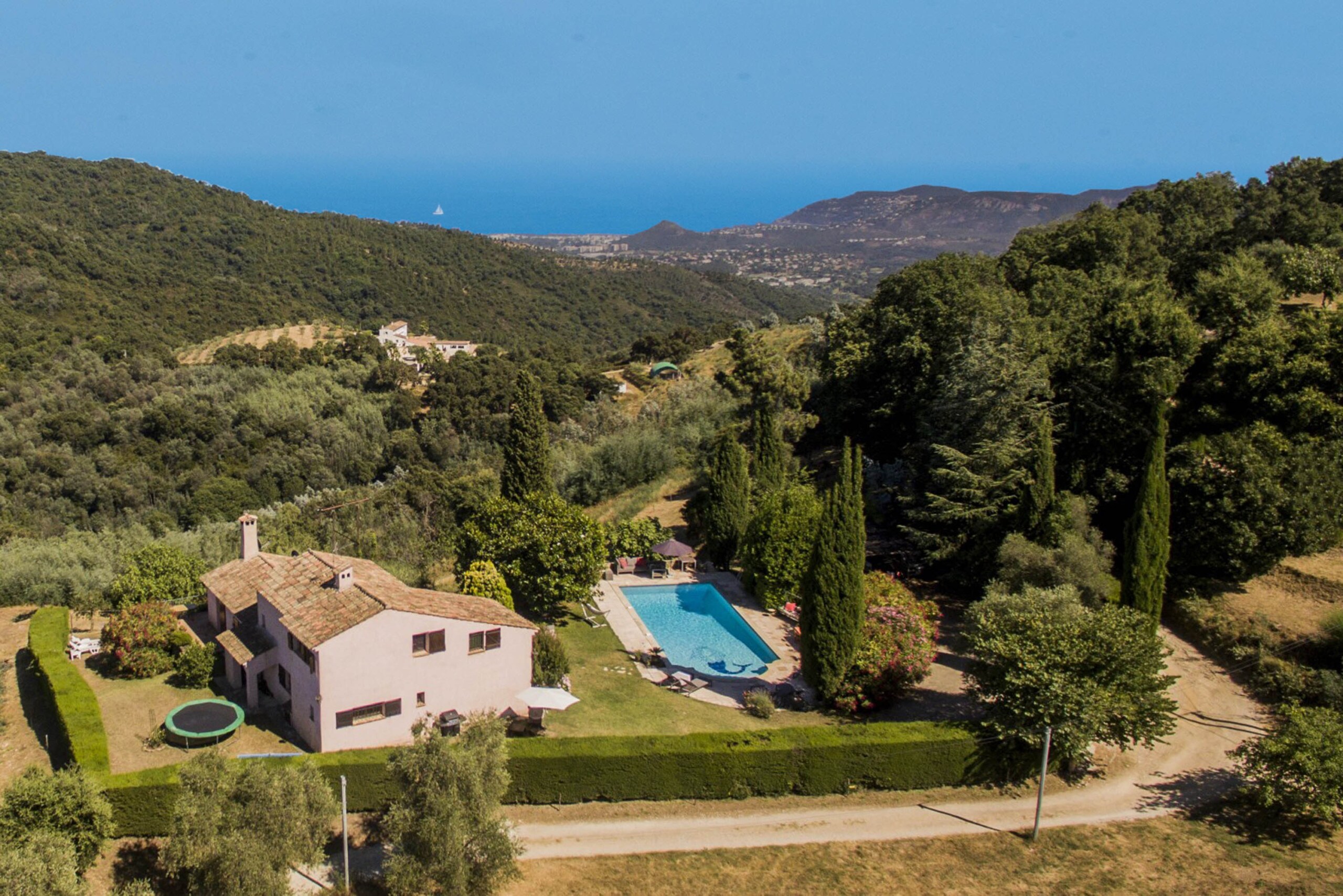 A stunning aerial view showcasing our villa, the spacious pool, and the breathtaking view of the Bay of Cannes.