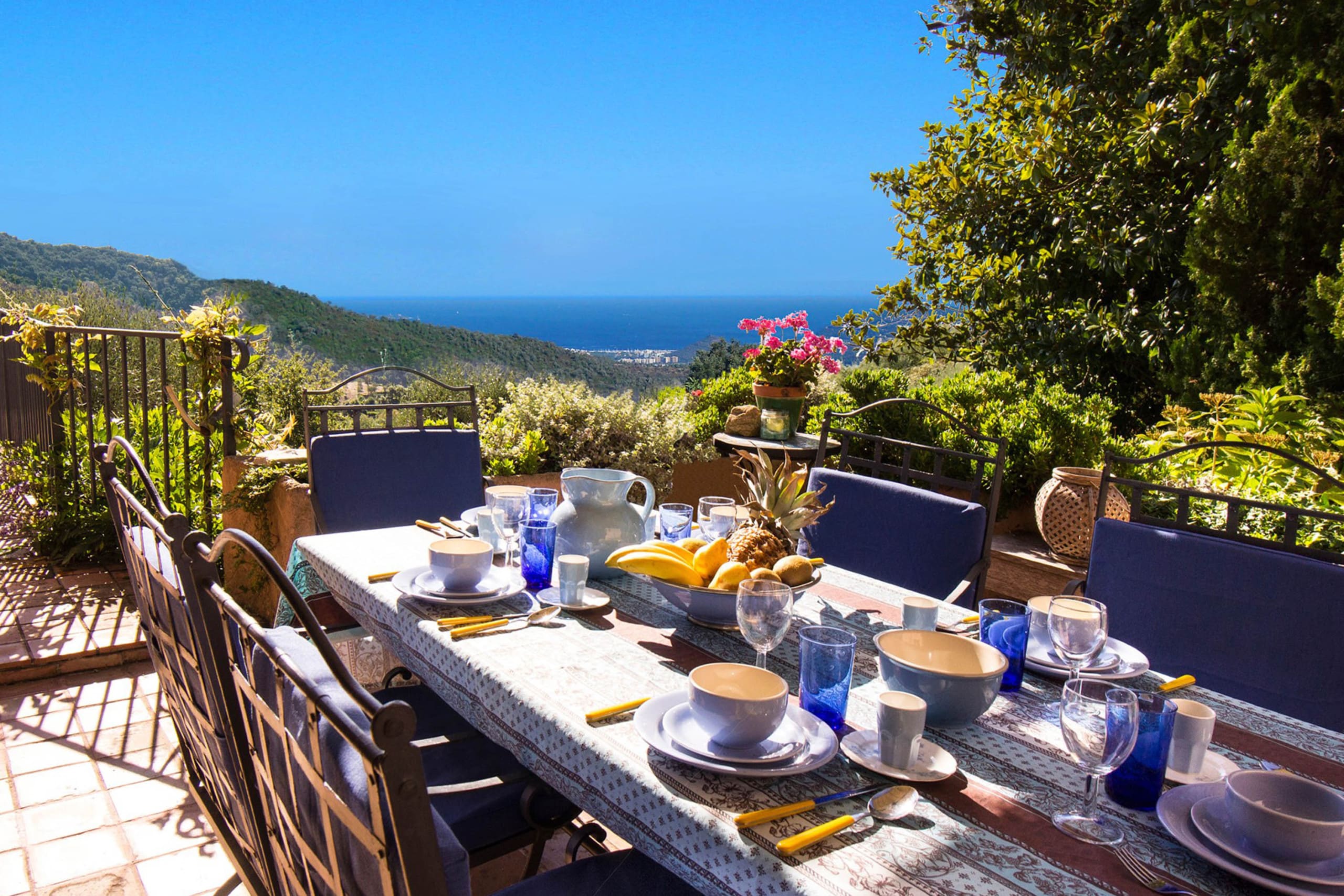 Enjoy al fresco dining on our terrace with a stunning view of the Bay of Cannes in the background.