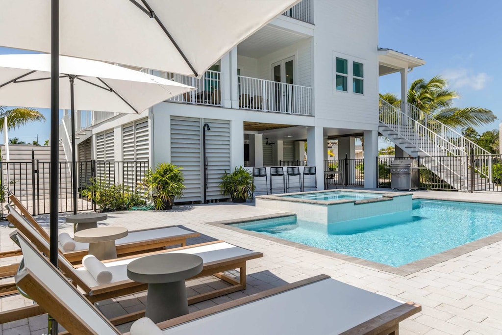 Heated pool and luxury lounge area. We provide towels!