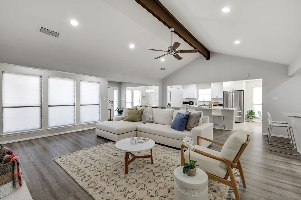 Spacious and airy with vaulted ceilings, this spacious open-concept living room is perfect for creating unforgettable memories with family & friends.