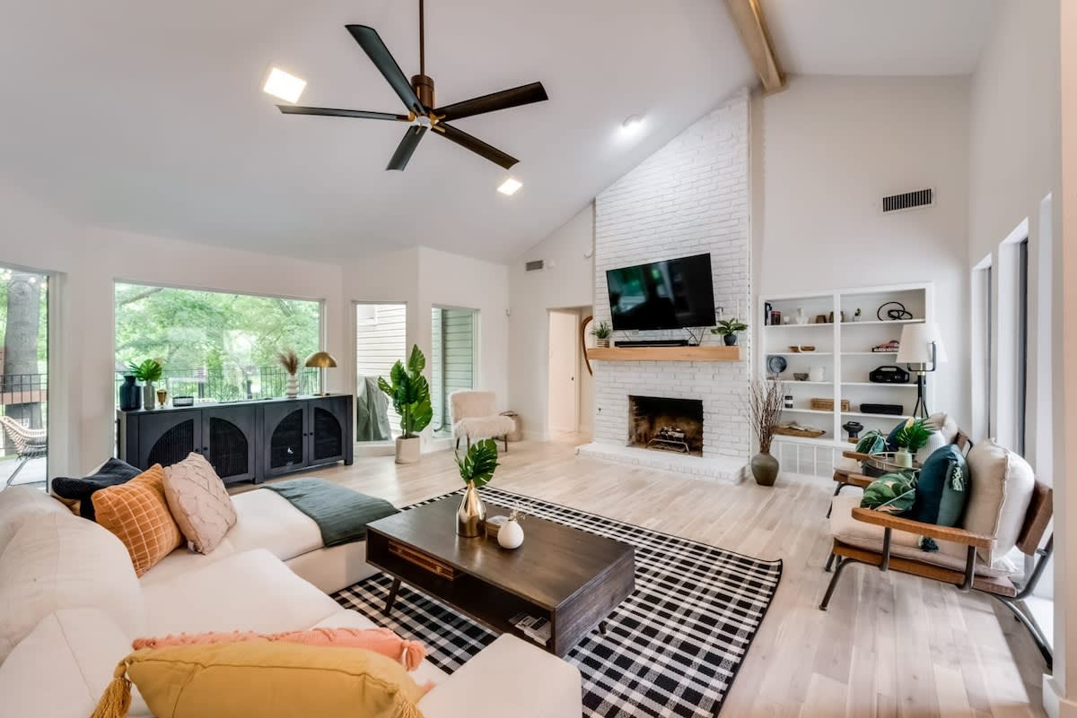 Modern and chic with spacious high vaulted ceilings and rustic wooden accents, this living area was designed for creating great memories with family and friends!