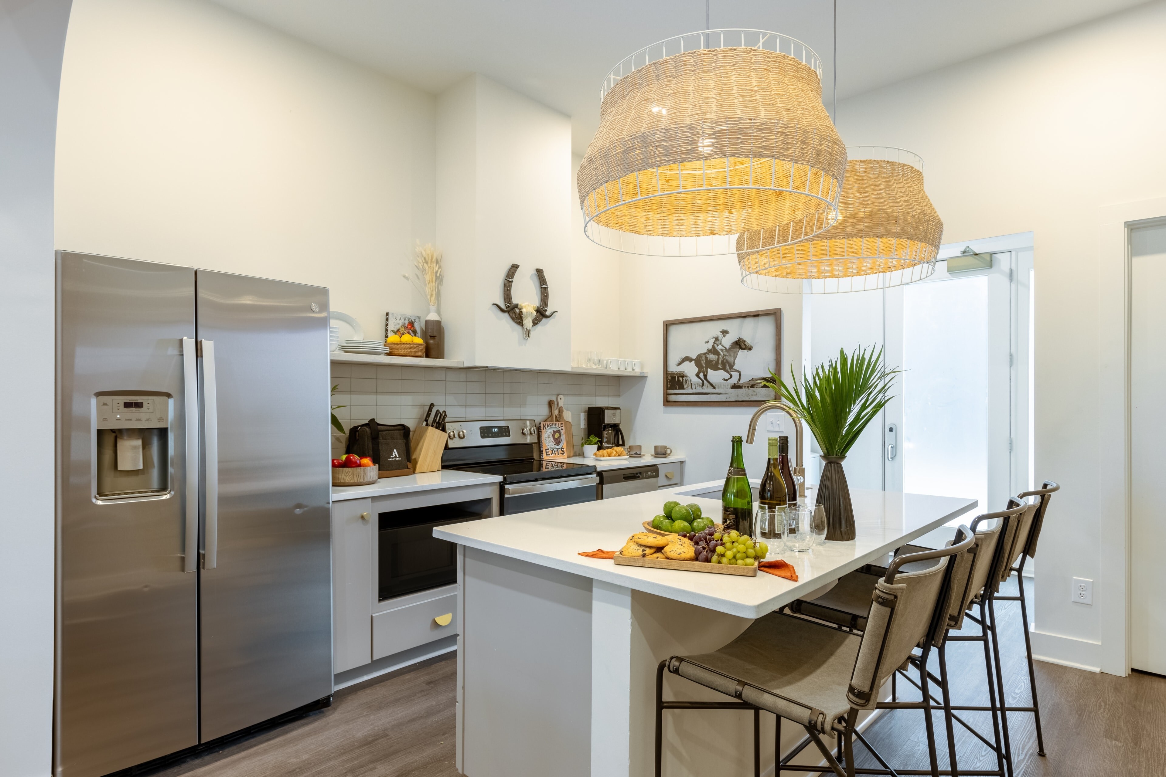 Fully equipped kitchen with barstool seating.