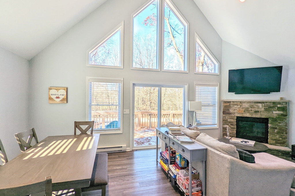 Cozy living room with fireplace and deck access.