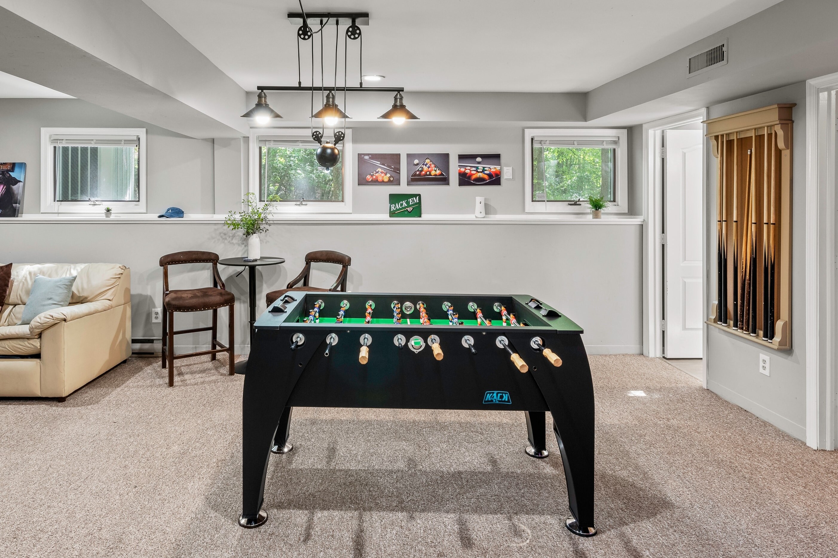 Featuring a foosball table, ping-pong table, dart board and streaming TV for movie nights!